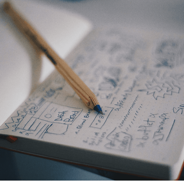 Strategy notebook with campaign sketches